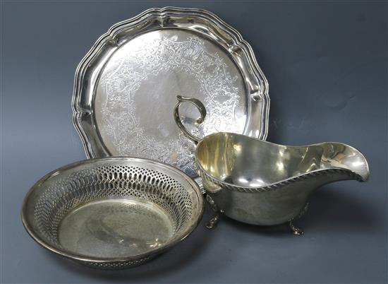 A George V silver sauceboat, a late Victorian silver salver and a pierced silver bowl.